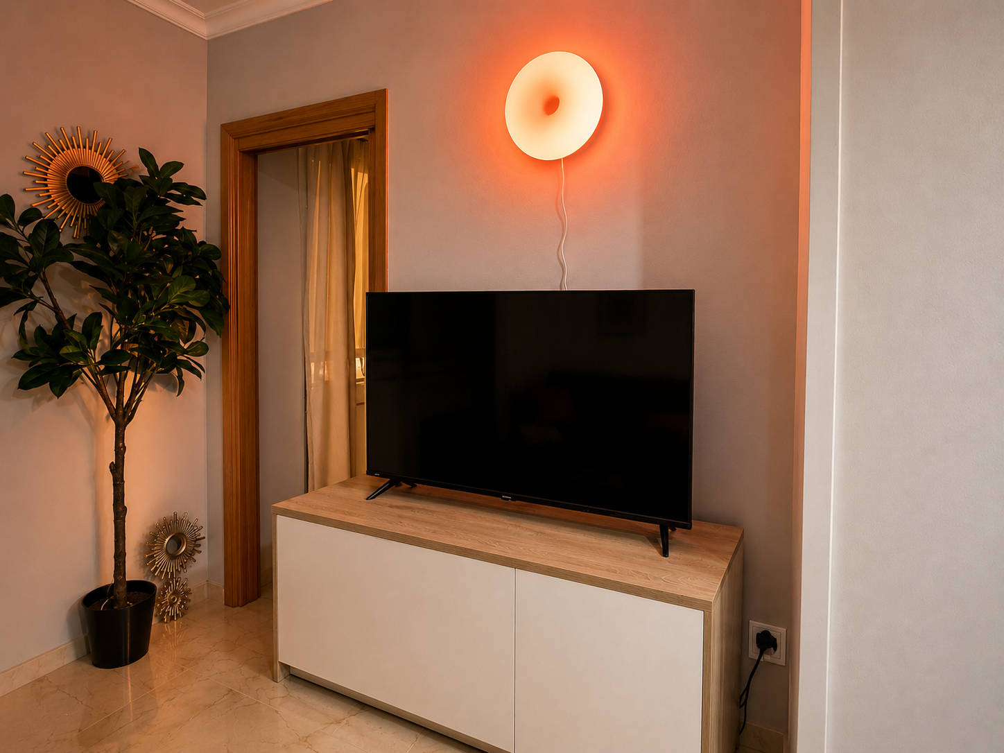 Living room with television and warm lighting