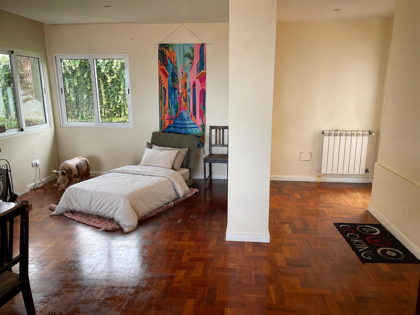 Bedroom with colourful artwork